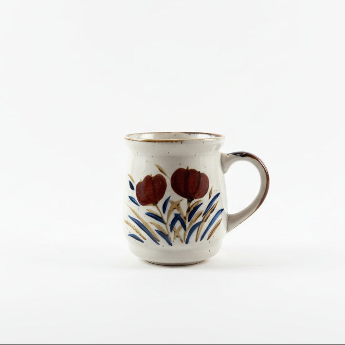 Vintage Japanese Stoneware Ceramic mug with floral design on a white background